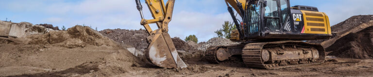 A construction site features a machine in action.