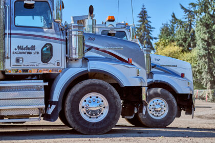 A close up of two trucks.
