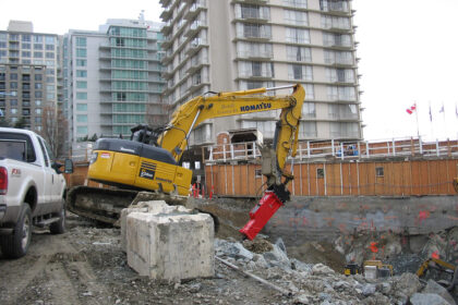A construction site featuring heavy machinery in action.