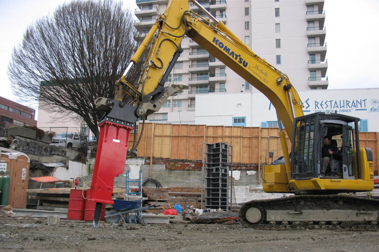 A construction site featuring heavy machinery in action.