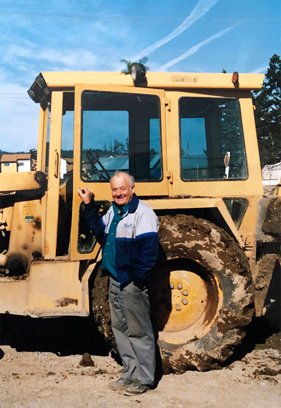 A Michell team member stands in front of machinery.
