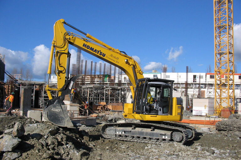 A construction site featuring heavy machinery in action.