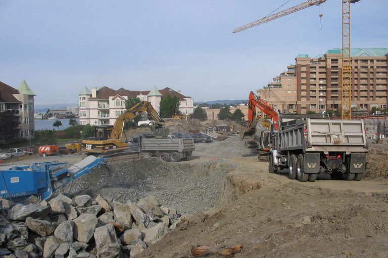 A construction site featuring heavy machinery in action.