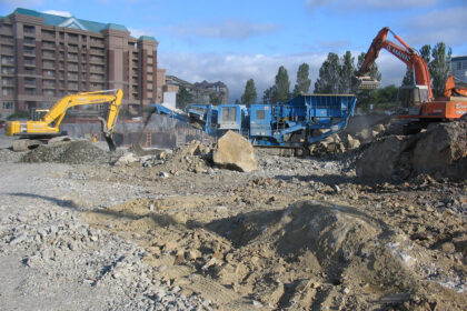 A construction site featuring heavy machinery in action.